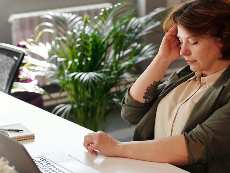 woman-holding-her-head-stressed